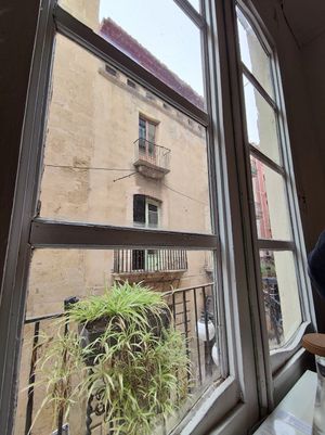 Inside looking out at El Vergel Veggie Restaurant in Tarragona