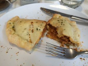 Calzone with bolognese ragout and vegan mozzarella at El Vergel Veggie Restaurant in Tarragona
