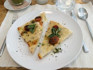 Homemade focaccia with cherry tomatoes and thyme at El Vergel Veggie Restaurant in Tarragona