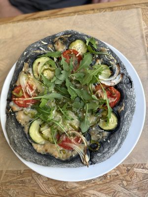 Black pizza  at El Vergel Veggie Restaurant in Tarragona