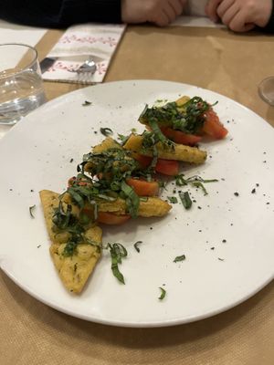 Panelle (chickpea fritter) with tomato and basil   at El Vergel Veggie Restaurant in Tarragona