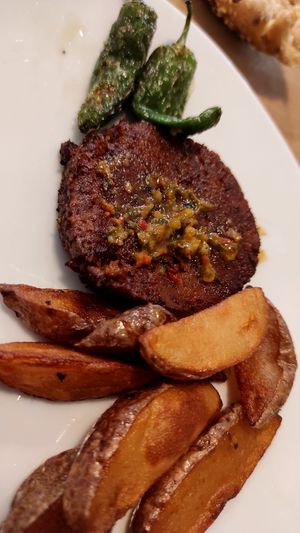 Chorizo con patatas y salsa chimichurri at El Vergel Veggie Restaurant in Tarragona