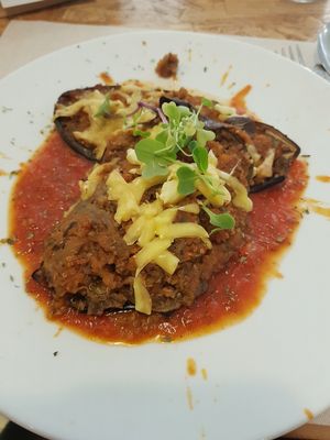 Stuffed aubergine with quiona bolognese at El Vergel Veggie Restaurant in Tarragona