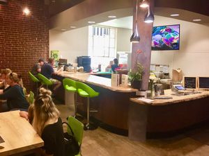 Tables and counter seating areas—very clean and fun at Raw Fresno in Fresno