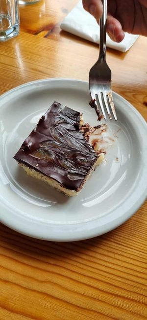 Vegan chocolate coconut slice 😋  They serve it warm. at Argyll Hotel Restaurant in Isle Of Iona