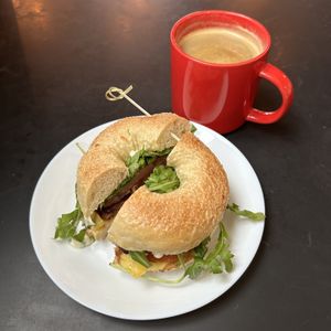 Sausage and Egg Bagel (add fresh greens & tomatoes) and an Americano  at Democracy* in Hamilton