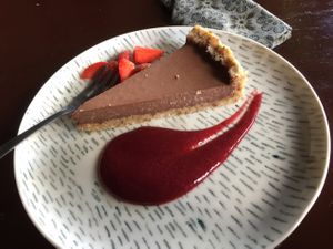 vegan raw chocolate pie with strawberry sauce at Elephant Cafe in Ubud