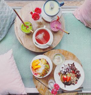 Smoothie bowl with fruit topping, gluten-free American pancakes with chocolate and nuts, smoothies and tea - yum!  at Fern & Fika in Stockholm