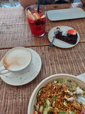 Taco bowl salad, cappuccino, Ice tea (home made), raw chocolate cake. at Fern & Fika in Stockholm