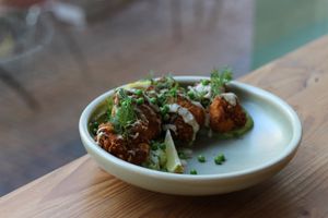 Snacks at Gys - In the photo you see the cauliflower wings- cream of broccoli, pea, garlic-mint yoghurt, dill

(100% organic, gluten-free and vegan)  at GYS - Voorstraat in Utrecht
