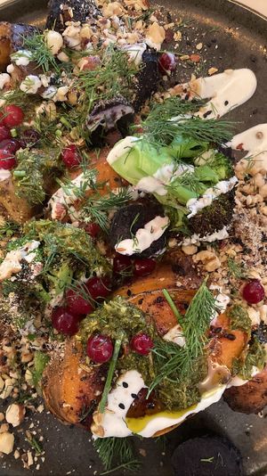 Jacket Potato Club: Grilled sweet potato, tahini yoghurt, chimichurri, roasted vegetables, dukkah, pomegranate, fresh herbs. A delicious whole food option!   at GYS - Voorstraat in Utrecht