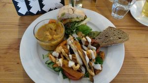 Small vegan tasting platter: half a burger, bread with guacamole, some 'kapsalon' and a curry. at GYS - Voorstraat in Utrecht