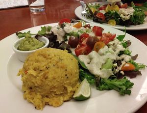 Upma lunch meal includes a generous salad. at Good Eden in New Orleans