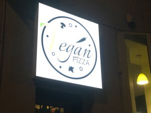 sign outside  at Vegan Pizza in Warsaw