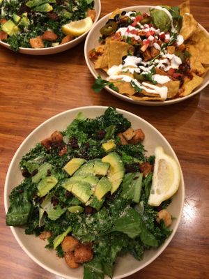 Kale Caesar salad and nachos at Veggie Grill by Next Level in Pasadena