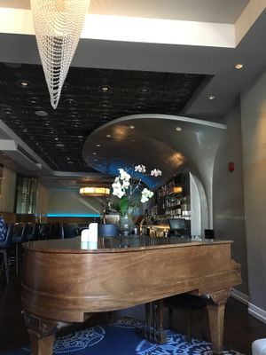 Piano in front of bar at Au Lac - DTLA in Los Angeles