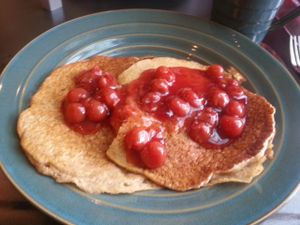 pancakes with cherry topping at World Peace Cafe in Baltimore