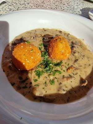 thyme knödel with mushroom sauce (vegan) at Gasthaus am Predigtstuhl in Vienna