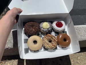 Middle in the top is called Bavarian Creme, bottom left is cinnamon sugar, and top right is strawberry jelly. Can’t remember the names of the others but they are all amazing! at Broad  Street Dough Co in Oakhurst