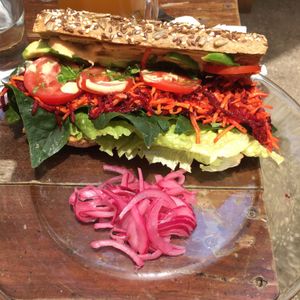 El Crudo sandwich - spinach, avocado, tomatoes, lettuce, carrot, beetroot, coriander and sprouts. Dressed with mustard and chipotle vegan mayo.  $67  at Co.ConAmor in Tulum
