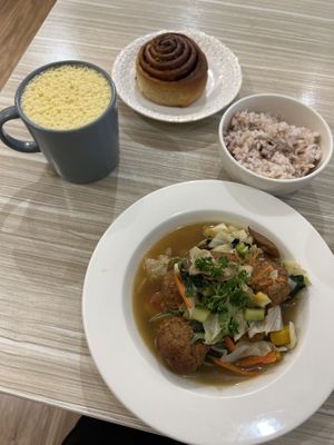 Stewed veggie balls in ginger soy sauce, hot pumpkin soymilk, and a cinnamon roll.  at Rice Revolution 呷米蔬食 - Gā Mǐ Shū Shí in Taipei