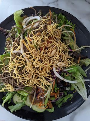 Soba ramen salad (on a plate) at Sushi Momo in Montreal