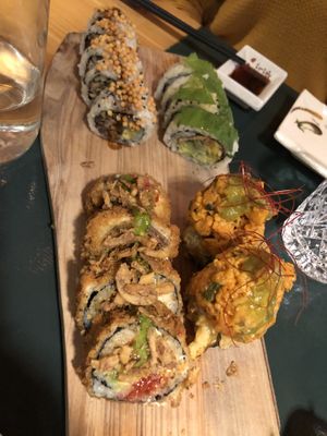 Clockwise starting on top: 3 champions, momo, Fuji flambé, gyu  at Sushi Momo in Montreal