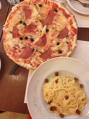 Capricciosa pizza €14.00, Spaghetti carbonara €14.00 at Origano Trevi in Rome