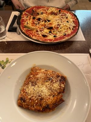The lasagne was delicious and was a great portion size. The pizza was tasty, with vegan cheese, black olives, artichoke, and vegan ham.  at Origano Trevi in Rome