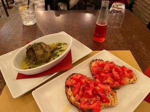 Bruschetta in front, artichoke alla romana in back. at Origano Trevi in Rome