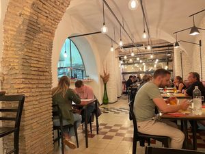The dining area (and part of the kitchen). at Origano Trevi in Rome