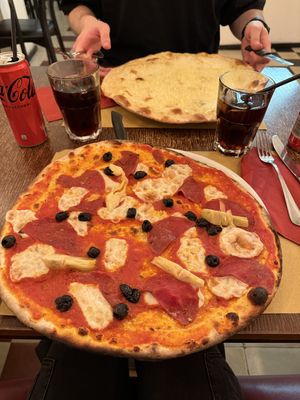 Pizza diavolo with olives and artichokes   at Origano Trevi in Rome