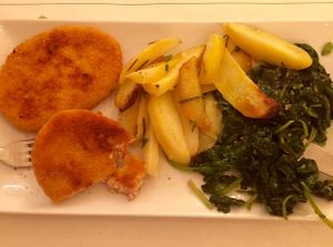 Breaded soy cutlet with potatoes and spinach at Origano Trevi in Rome