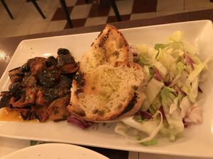 Eggplant and tomato served with salad and bread at Origano Trevi in Rome