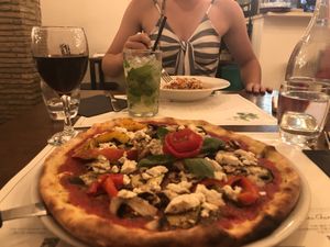 The vegan tofu pizza with a cute tomato rose! at Origano Trevi in Rome