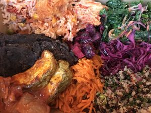 A little bit of everything: refried black beans, rice, zucchini, kimchi,... at Jungle Cafe in Brooklyn