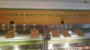 "We cook in peace so you can eat in peace" at Jungle Cafe in Brooklyn