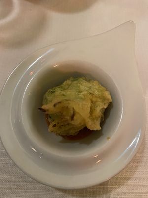 Steamed broccoli in a light tempura batter laid on a fresh cherry tomato sauce.  at Ristorante Da Mario alla Fava in Venice