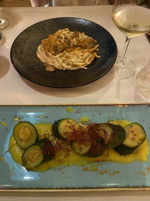 Pasta with a creamy artichoke sauce and on the bottom was a zucchini with chickpea filling with a generous layer of saffron on top    at Ristorante Da Mario alla Fava in Venice