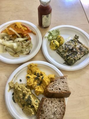 Two different kinds of hummus on one plate, grilled fennel bulbs & squash on another & potato balls & chickpea pie   at Rumi Bottega Organica in Rome