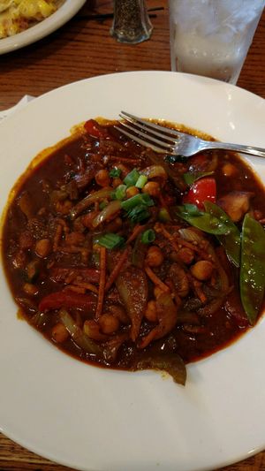 lunch vegan stew. a bit spicy. lots of black pepper, including rock hard pieces not ground enough. I had to spit out chunks of black pepper. at Soup Spoon Cafe in Lansing