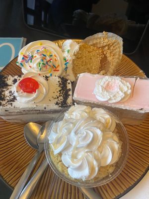 Chocolate & vanilla cake slices, cupcakes and mango drizzled cake cup.  at Rashmi's Bakery in Brampton