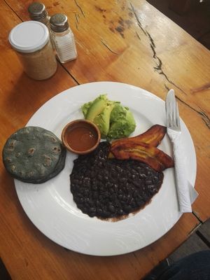 "Veganized" version of the breakfast "Tipico" which comes normally with egg and white cheese. I got an extra portion of aguacate. at Circles Cafe and Hostel in San Marcos La Laguna