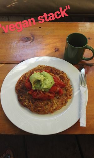 Vegan Stack - Potato hash topped with fried tomato, pepper, chili, onion & avocado

Would be enough for two! Share it! at Circles Cafe and Hostel in San Marcos La Laguna