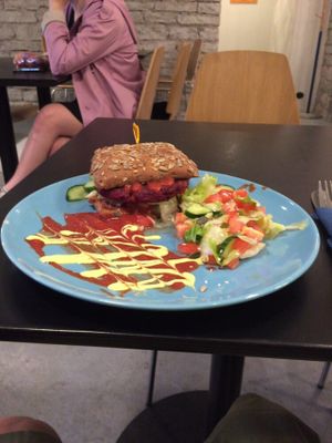 Beetroot burger with spicy tomato sauce, come with salad but chips are sold separately  at Vegan Inspiratsioon in Tallinn