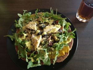 Gluten free pizza and black ice tea at Vegan Inspiratsioon in Tallinn