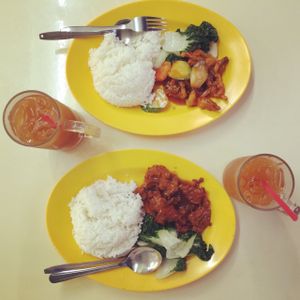 set meal. each $4. top is #6 (sweet sour mushroom) and bottom is #7 (cutlet). paired with less sweet ice lemon tea $1.30 at Hong Hoo in West Singapore