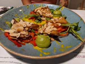 Tempeh con mandorle e peperoni. at Romeow Cat Bistrot in Rome