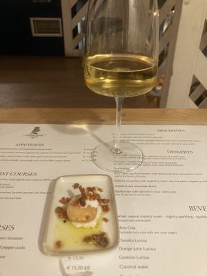 Compliments of the kitchen, air bread with vegan feta and crispy tomatoes   at Romeow Cat Bistrot in Rome