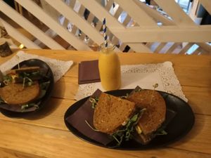 Sandwich with mango shake at Romeow Cat Bistrot in Rome